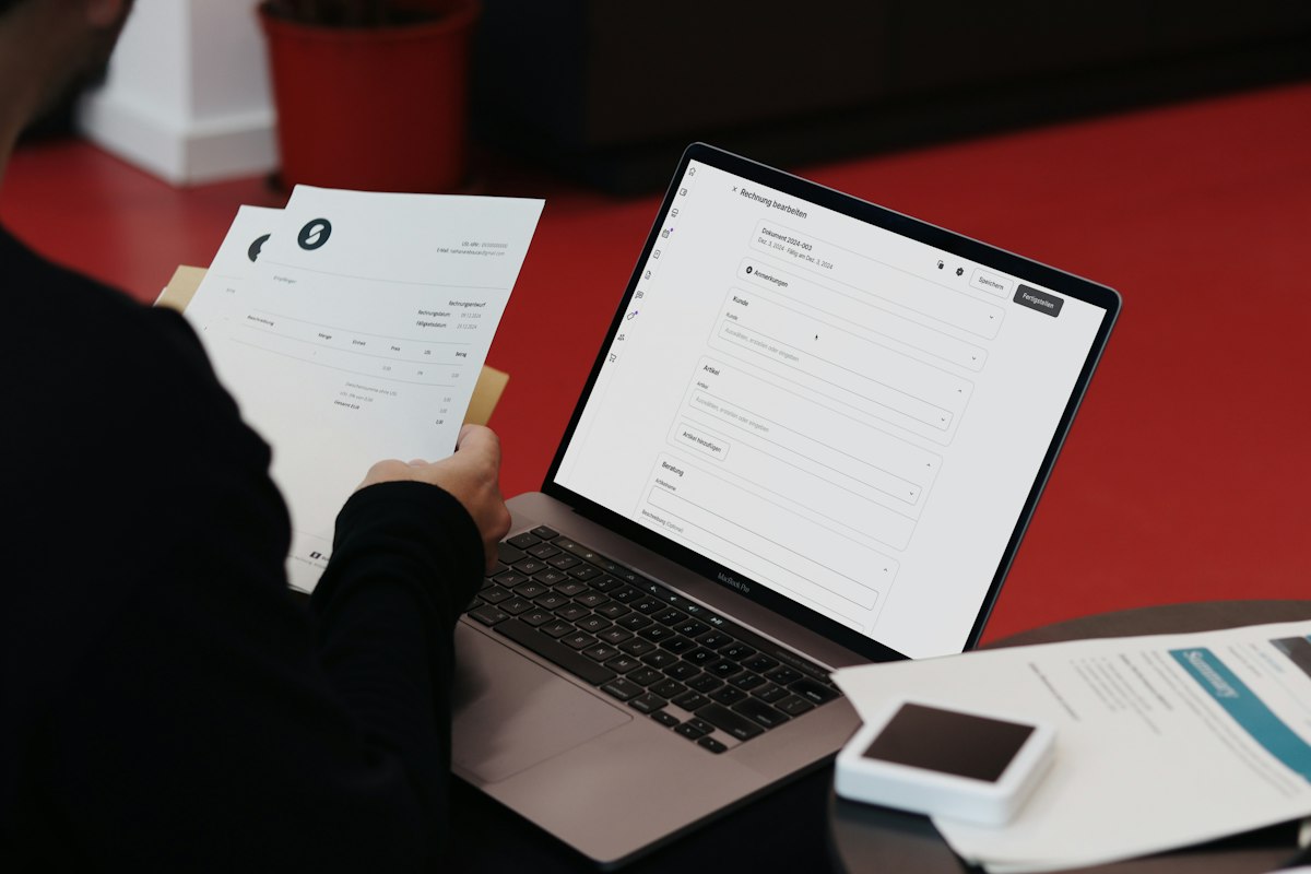 Person working on a laptop with coffee, weighing Microsoft 365 vs Office 2024